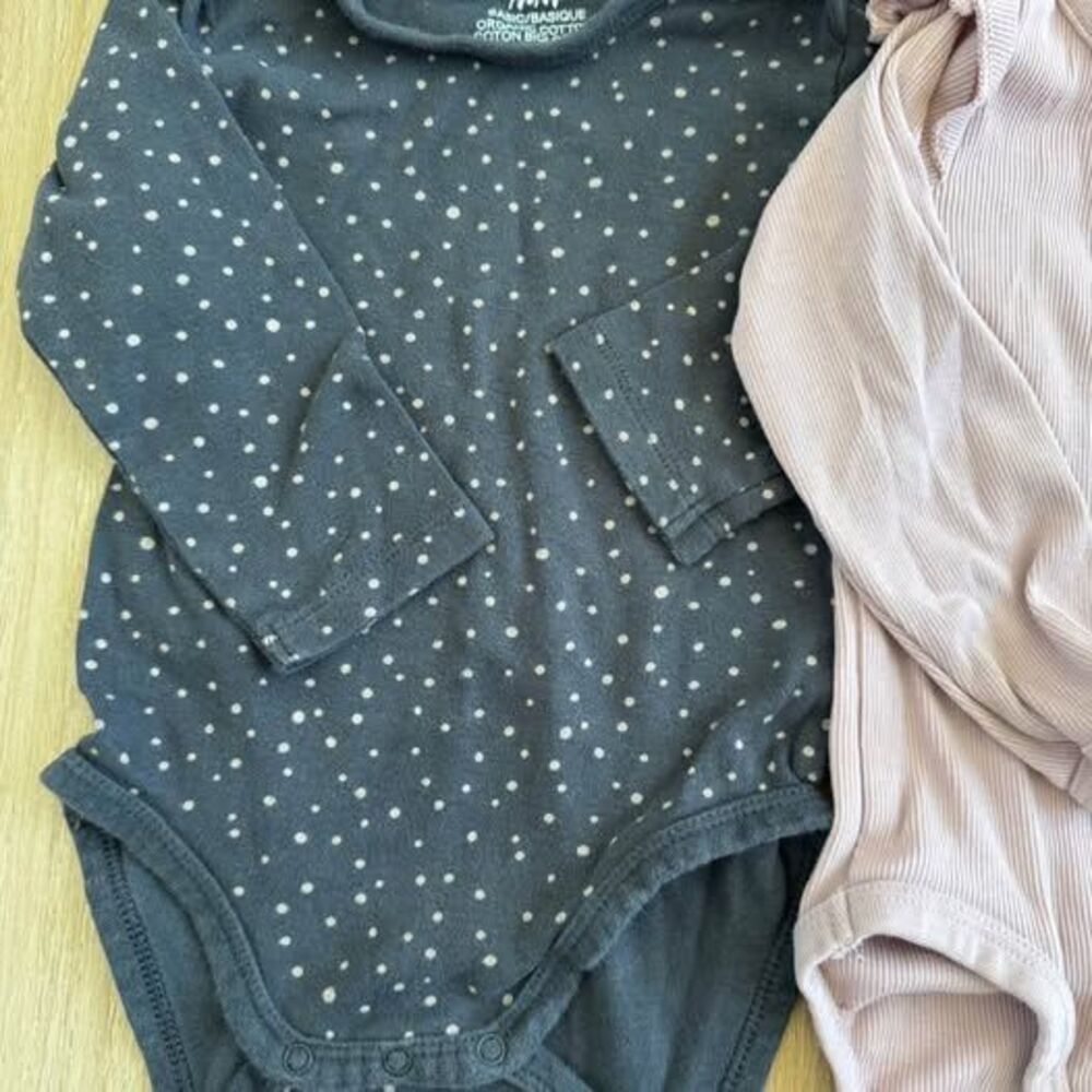 Set up two H&M long sleeve onesies. 6-9 months. 